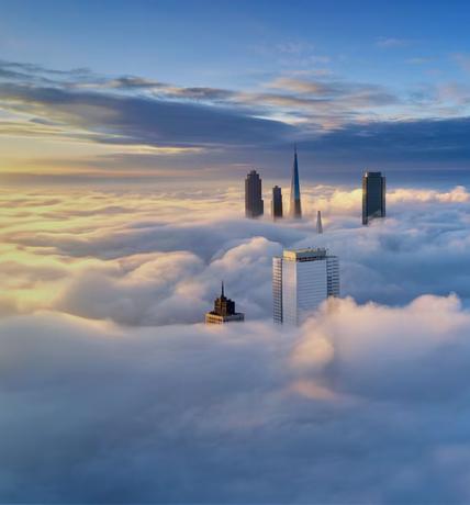Aerial View of a city on Thick Cloud