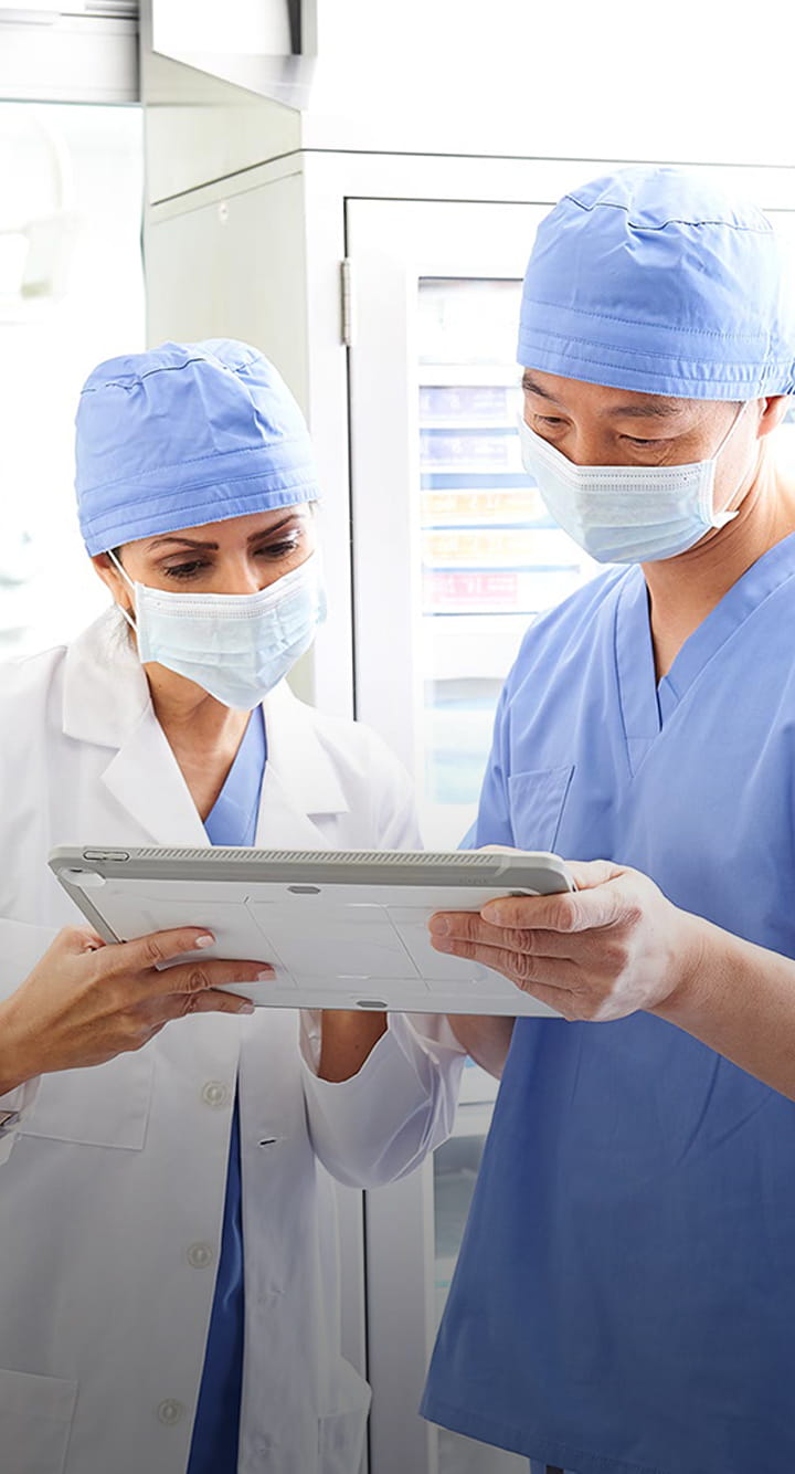 doctors examining something on notepad