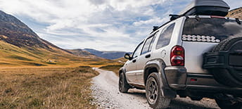 car with mountains ahead