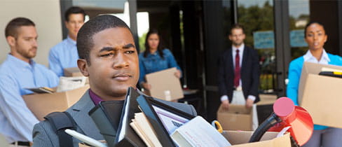 Group of professionals leaving office after layoff or being fired