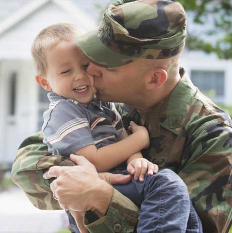 soldier holding baby
