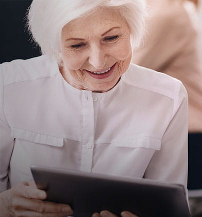 woman looking at tablet