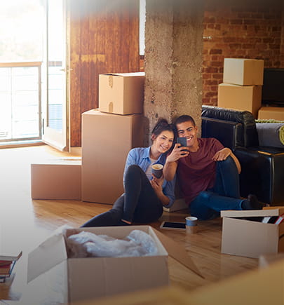 Couple at home with moving boxes