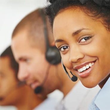 female call center executive smiling at camera