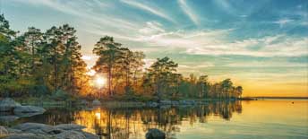 autumn landscape on the lake at sunset time