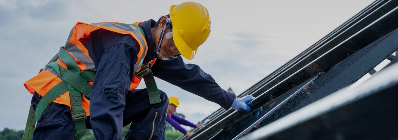 Professional worker wearing safety uniforms working at high place