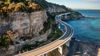 highway over water and side of cliff