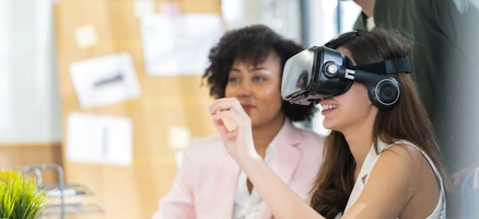 Group of millennial male and female multiethnic using vr goggle to test metaverse meeting system cheerful and smiling