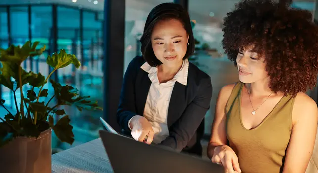 Shot of two businesswomen working together on a laptop