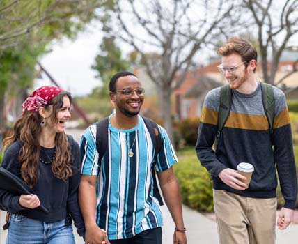 Diverse College Students Walking on Campus