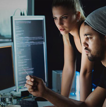 Cropped shot of two people working late at night