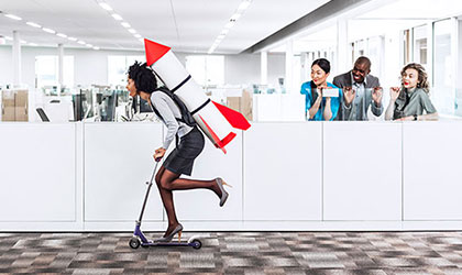 woman riding scooter with rocket on her back