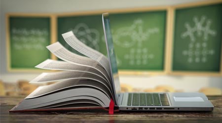 Elearning Online Education Or Internet Encyclopedia Concept Open Laptop And Book Compilation In A Classroom High-Res Stock Photo