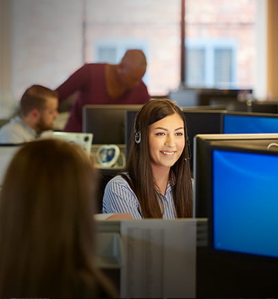 Support desk woman on call and computer