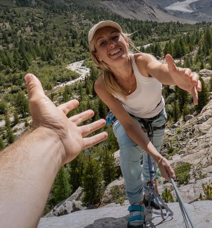 Smiling woman tourist hiking mountain trail