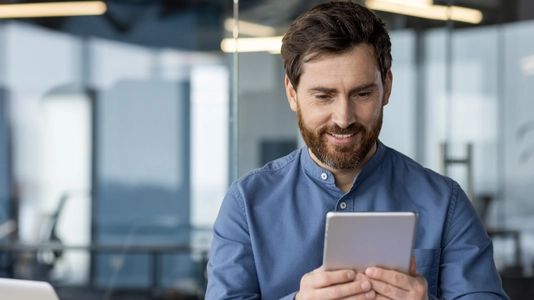 The man is using tablet 