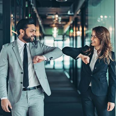 business partners greeting with elbow bump