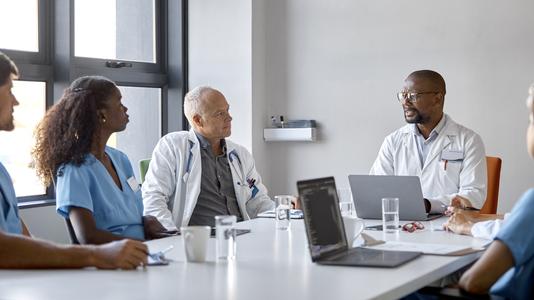 Medical professionals discussing in a meeting room