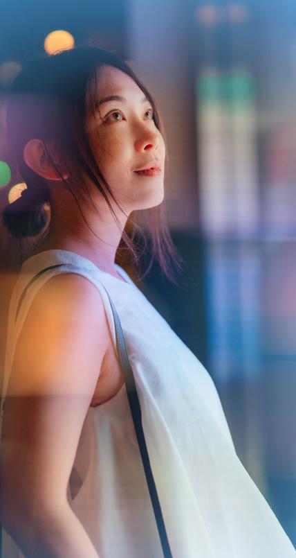 Young woman looking at futuristic digital display