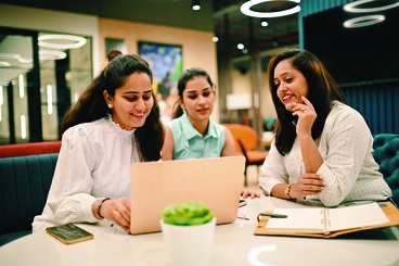 Group of women discussing in a co-working office