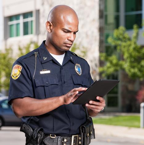 police officer using a tablet