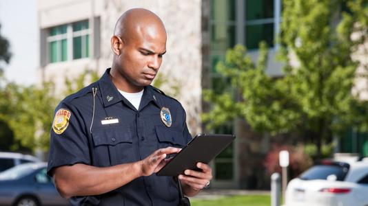 police officer using a tablet