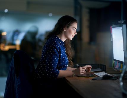 Employee is working with her laptop