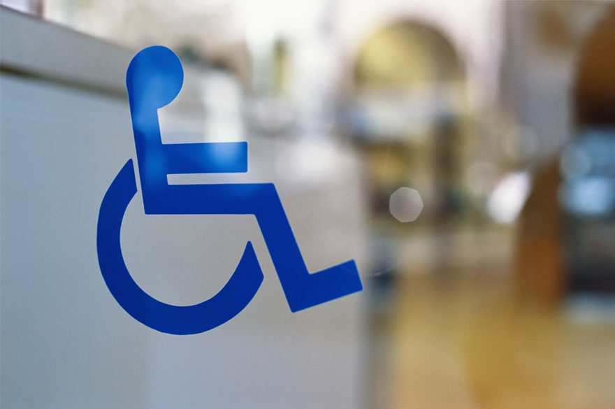 wheelchair symbol on glass door