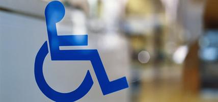 wheelchair symbol on glass door