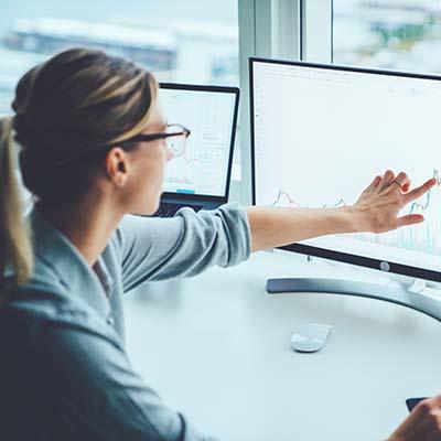 A woman is doing some Data analysis of her workplace