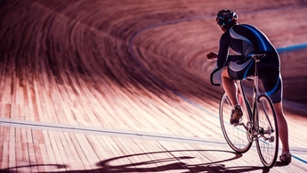 man on bike on wooden platform