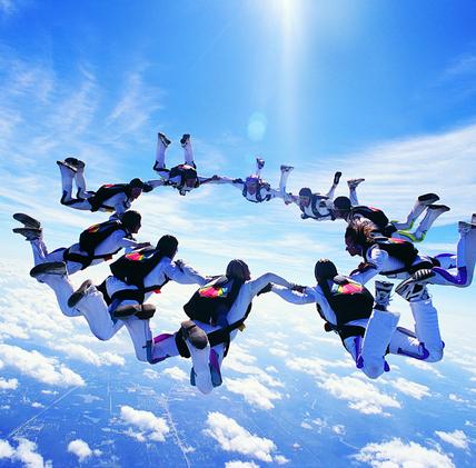 People jumping from sky in a group