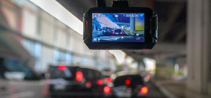 Dash Camera or car video recorder in vehicle on the way